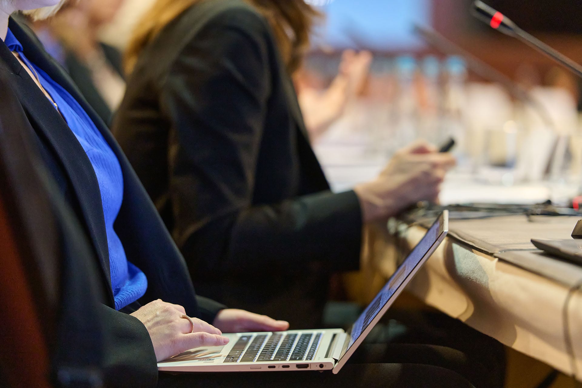 A woman holding a laptop